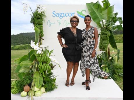 Julia Brown (left), chief executive officer of JMB Legacy Consulting, and Issia Madden, managing director of Design HQ, strike a pose at the Her Farm to Your Table Brunch held on Sunday.