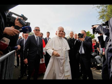 Pope Leo XIV visits the parish complex of the Santa Maria della Presentazione on the outskirts of Rome, Sunday, March 8, 2026. (AP Photo)