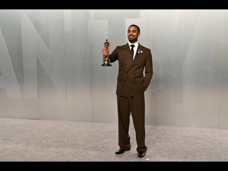 Credit: AP Michael B. Jordan proudly holds his first Oscar trophy for best actor, celebrating his dual role in ‘Sinners’.