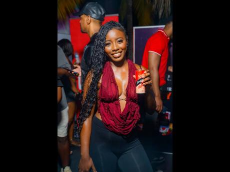 Credit: Contributed Red is definitely pension administrator Junay Buchanan’s colour.