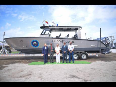 Chief of Defence Staff, Vice Admiral Antonette Wemyss-Gorman (centre), shares a photo opportunity with (from left) Senior Vice President, Metal Shark, Henry Irizarry; Permanent Secretary in the Office of the Prime Minister, Ambassador Rocky Meade; Commissi