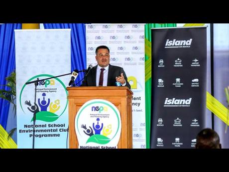 Matthew Samuda, minister of water, environment and climate change, delivers the keynote address at the recent National School Environmental Club Programme Workshop held at Titchfield High School.