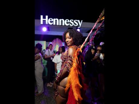 Credit: Contributed Yard Mas model Amina McKenzie stuns in Ebony, which pays homage to the world of Jamaica-born visual artist and educator Ebony G. Patterson.