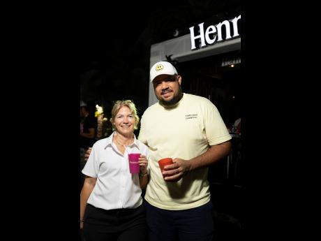 Credit: Contributed Tania McConnell (left), corporate marketing manager, Select Brands, and Yard Mas Managing Director Andrew Bellamy, pause for a snap at the Spirit of Carnival launch.