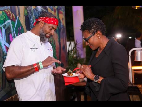 Audrey Tugwell Henry, president and CEO, Scotia Group Jamaica, speaks with Chef Scotley Innis on his bold Kuyah menu.