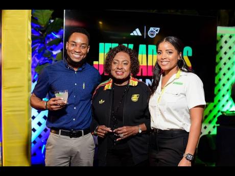 Credit: Contributed Pavel Smith, marketing manager, J. Wray & Nephew Ltd., and his colleague, Simone Foster (right), brand experience manager, share a moment with Olivia Grange (centre), minister of culture, gender, entertainment and sport.