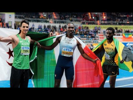 Jamaica’s Jordan Scott (right), silver medallist in the triple jump on the opening day of the 2026 World Indoor Championships, poses with gold medallist Andy Diaz Hernandez (centre) of Italy and bronze medallist Yasser Mohammed Triiki of Algeria.  