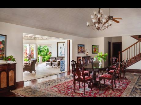 Credit: Contributed The dining room opens wide to covered outdoor dining and living rooms.