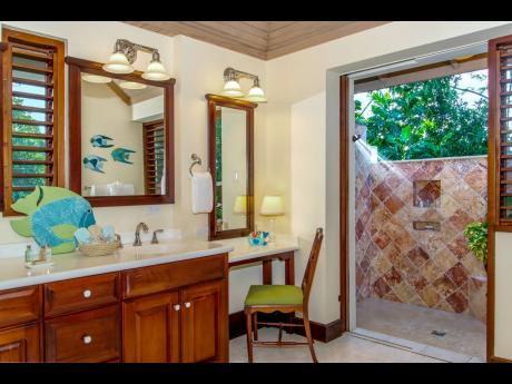 Credit: Nigel Lord Bathrooms surprise with rarely seen indoor and outdoor showers in each.