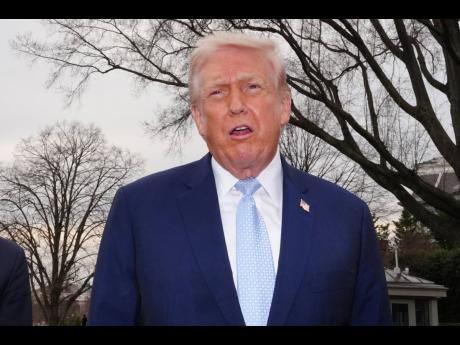 President Donald Trump speaks with reporters before departing on Marine One from the South Lawn of the White House, Friday, March 20, 2026, in Washington. (AP Photo/Alex Brandon)