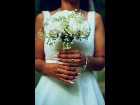 Kady-Ann’s wedding dress, simple yet elegant, was from Odd Muse London and complemented by a bouquet of hydrangeas, baby’s breath, and white roses.