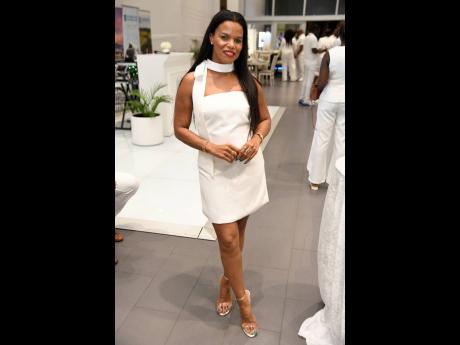 Sheryl Hines Evans, financial adviser, opts for a classic white mini, complemented by metallic heels.