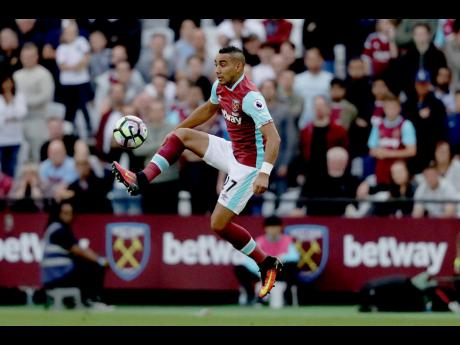 West Ham United’s Dimitri Payet controls the ball during the English Premier League football match against Southampton in London, on September 25, 2016.