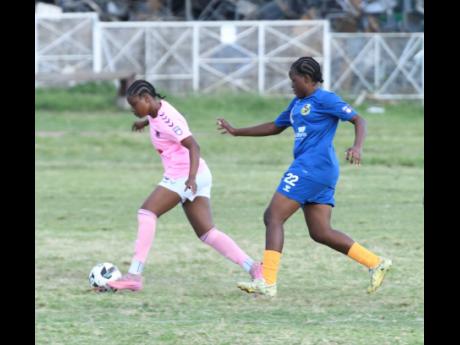 Frazsiers Whip’s Kersha Thomas dribbles away from Springers United FC’s Jasheika Harris during a Jamaica Women’s Premier League fixture at the Excelsior High School on Saturday.