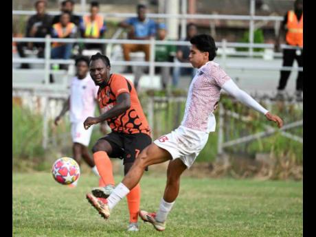 Tivoli Gardens’ Rodico Wellington (left) makes a pass while Chapelton Maroons’ Jerónimo Herrera Taborda tries to intercept during a Jamaica Premier League encounter at the Edward Seaga Sports Complex on December 29, 2025.