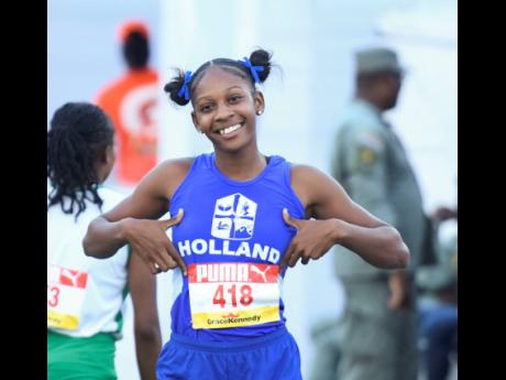 Holland High School’s Shanoya Douglas was relaxed after winning her Class 1 100-metre heat at yesterday’s ISSA/GraceKennedy Boys and Girls’ Athletics Championships inside the National Stadium yesterday.