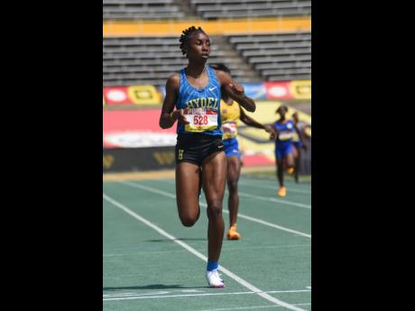 Credit: Ian Allen Hydel’s Nastassia Fletcher wins her race in the Girls’ Class One 400m at Champs 2026.