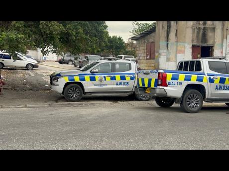 Credit: Police vehicles parked at a parking lot near Kingston Public Hospital, where officers are investigating a fatal shooting on March 25, 2026.