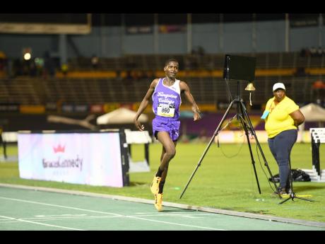 Kingston College’s Julius Itubo crosses the finish line to win the boys' Class Three 1500m final at the ISSA/GraceKennedy Boys and Girls’ Athletics Championships on March 25, 2026. He set new record of 4:00.76. (Antoine Lodge photo)
