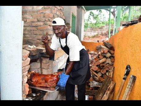 Journeying from Lambs River Seaforth, Westmoreland, lechonero Orel ‘Kool Kat’ Clarke makes his signature pig at Ena Jamaica’s Brick Oven Wednesdays.