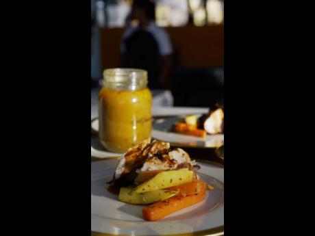 Spicy bourbon chicken served with a side of sauteed garlic butter vegetables and beef pumpkin soup. 