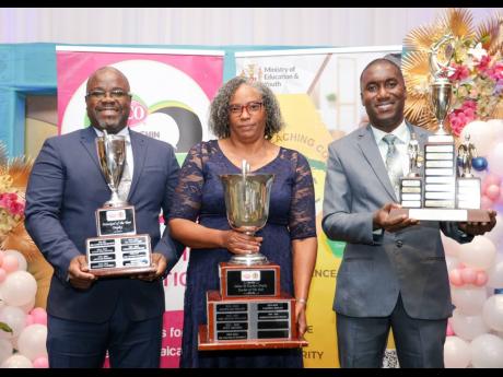 Dorette Rhoden Henry, teacher of deCarteret College and the 2025 LASCO, Ministry of Education, Skills, Youth and Information, Jamaica Teaching Council Teacher of the Year, with Orville Anthony Richards (left), principal of St Mary Technical High School, an