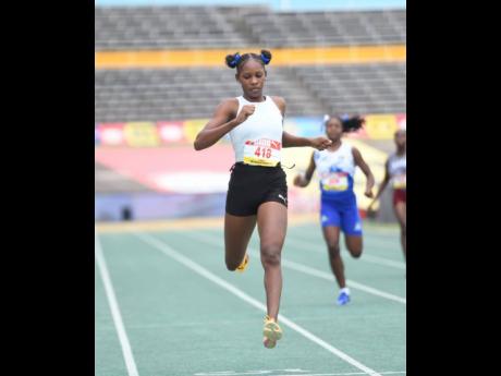 Credit: Antoine Lodge Holland High School sprint star Shanoya Douglas winning her girls’ Class One 200m heat at Champs 2026.