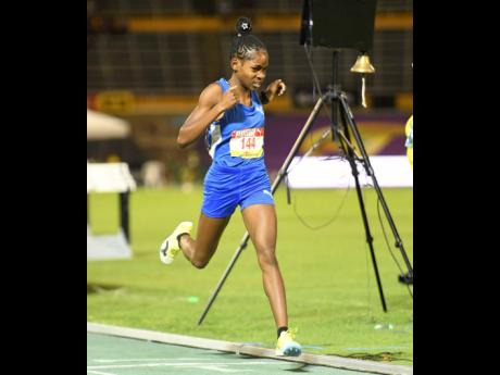 Credit: Antoine Lodge Alexjordan Hall of Clarendon College wins the Class Three girls 1500 metres final during the second day of the 2026 ISSA/GraceKennedy Boys and Girls’ Athletics Championships at the National Stadium.