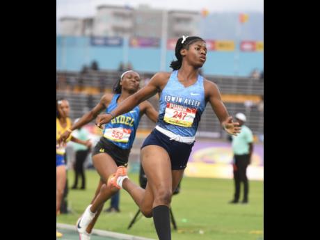 Credit: Edwin Allen High's Tashana Godfrey crosses the line in 10.75 seconds during the Class Three 80m hurdles semifinals at Champs. The time is below the record but will not be recognised because of the wind- assisted. (Ian Allen photo)