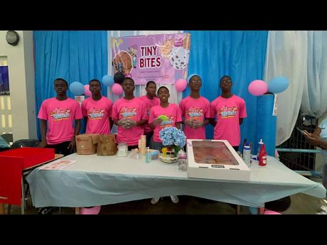 Credit: Contributed This group, operating the pastry business Tiny Bites, poses for a photo at their booth at the STGC Teen Biz Expo 2026.