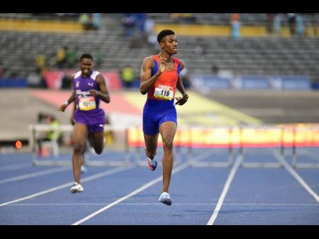 Credit: Kenyon Hemans Roshawn Clarke of Camperdown High wins the Class One boys’ 400 metres hurdles final in a record 49.50 seconds at the 2022 ISSA/GraceKennedy Boys and Girls’ Championships at the National Stadium.