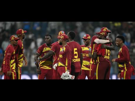 Credit: Courtesy of ICC West Indies players celebrate a win over England in their second Group C ICC T20 World Cup cricket game at the Wankhede Stadium in Mumbai, India, last month.