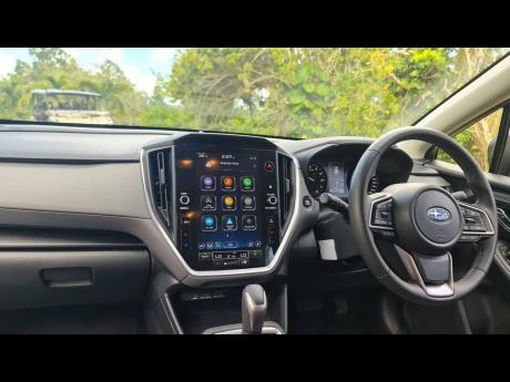 Credit: Kareem LaTouche The centre console is anchored by a massive 11.6-inch vertical interface that consolidates most vehicle functions into a single, high-definition command post.