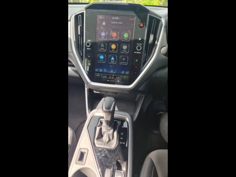 Credit: Kareem LaTouche The leather-wrapped gear selector is positioned within a straightforward, ergonomic housing, flanked by the activation switches for the dual-function X-MODE system.