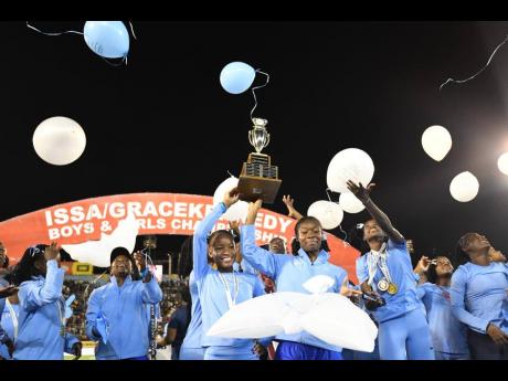 Edwin Allen Athletes celebrate winning the 2026 ISSA/GraceKennedy Boys and Girls’ Athletics Championships inside the National Stadium yesterday. 