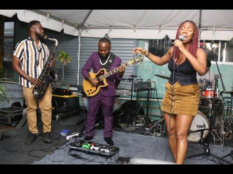 Credit: Nathaniel Stewart Bringing her sweet vocals to the stage, rising singer Tori Lattore (right) was right at home as she sang, supported by members of the Dub Squad band.