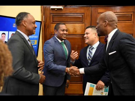 From left: Omar Sweeney, managing director of Jamaica Social Investment Fund; Floyd Green, minister of agriculture, fisheries and mining; Matthew Samuda, minister of water, environment and climate change; and Wayne Robertson, permanent secretary in the Min