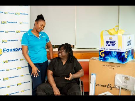 Kadeen Finn-Miller (left), programmes administrator at the NCB Foundation, listens keenly as Bridgette Small, a registered nurse and Grant a Wish beneficiary, shares a reflective moment at the recently held handover.