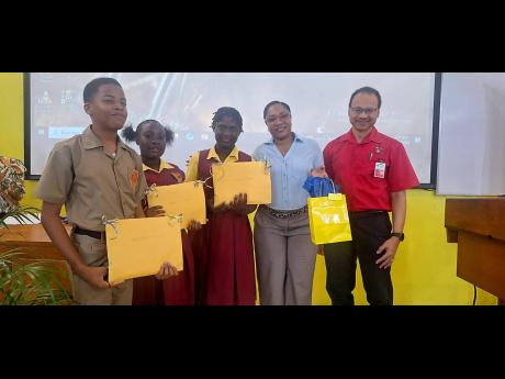 Spanish Town High School teacher Toni‑Ann James‑Robertson (second right) stands with students Hashane Miller, Shanice Wright and Tevesha Turner, alongside their STEM role model, Professor Daniel Coore (right) of Computer Science in the Department of Co