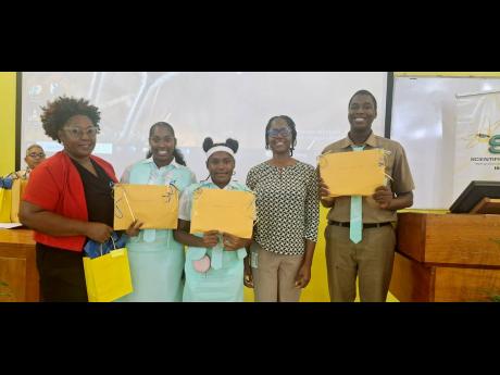 Lister Mair Gilby High School for the Deaf teacher Tainia Taylor (left) shares a photo with students Gabriel Jones, Keonah Macko and Tariq Ferguson, along with their STEM role model Dr Ainka Brown (second right), a lecturer in the Chemistry Department at t