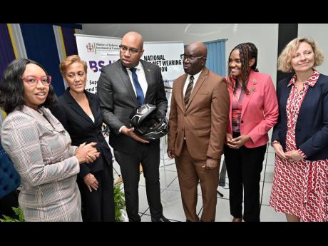 State Minister in the Ministry of Industry, Investment and Commerce, Delano Seiveright (third left), and Executive Director of the Bureau of Standards Jamaica (BSJ), Dr Velton Gooden (fourth left),  with (from left) Lead Youth and Education Programmes, Roa