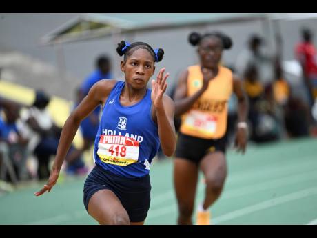 Shanoya Dougas of Holland High School on her way to winning the Girls’ Class One 200 metres at the ISSA/GraceKennedy Boys and Girls’ Athletics Championships.