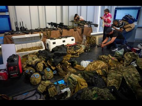 Weapons that Cuban authorities say were recovered from a speedboat in Cuban waters following a confrontation that left four people dead are displayed during a media presentation in Havana, February 27, 2026. 