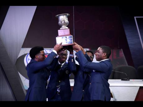 Credit: Antoine Lodge/Photographer Members of the Jamaica College team celebrate with the Schools’ Challenge Quiz championship trophy after their victory during the grand finale of the 2026 competition on Thursday night at TVJ’s studios in St Andrew.
