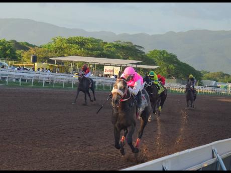 RIDEALLDAY, ridden by overseas-based jockey Javier Castellano, wins the fourth running of the Mouttet at Caymanas Park on Saturday, December 6, 2025.