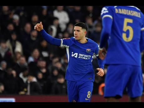 Chelsea’s Enzo Fernandez celebrates after scoring his side’s third goal during an English FA Cup fourth round  match between Aston Villa and Chelsea at the Villa Park Stadium in Birmingham, England in 2024.