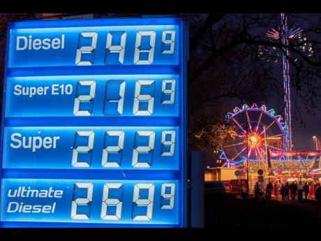 Credit: Michael Probst Gas prices are displayed near a ferris wheel in Frankfurt, Germany, Thursday, April 2, 2026. (AP Photo/Michael Probst)