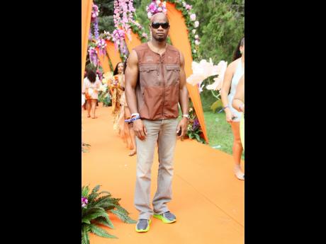 Sprint icon Asafa Powell opts for a relaxed look in a sleeveless Puma vest and fitted jeans