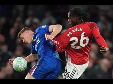 
Chelsea’s Liam Delap (left) and Manchester United’s Ayden Heaven challenge for the ball during their English Premier League football match at Stamford Bridge in London yesterday.