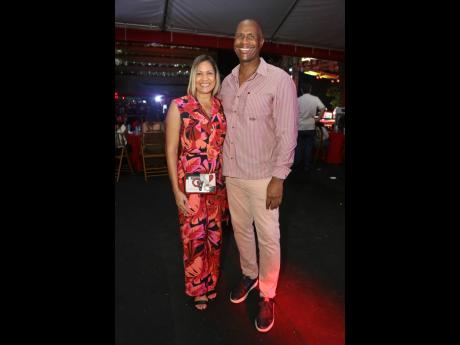 Credit: Nathaniel Stewart Bruce James, president and co-founder of MVP Track & Field Club, pairs up with financial executive Leesa Kow for a photo opportunity.